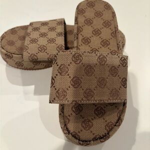 Monogram Patterned Brown Slides